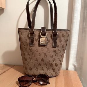 Dooney and Bourne bucket style purse with latch closure